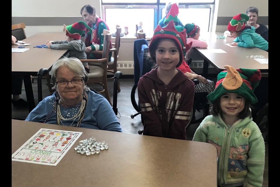 Kindergarten students from Harriett Todd Public School enjoyed Christmas bingo with residents of Oak Terrace Tuesday. 