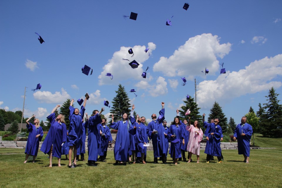 The graduates of the Orillia Learning Centre did a traditional hat throw at the end of Thursday's ceremony at Hawk Ridge. Mehreen Shahid/OrilliaMatters