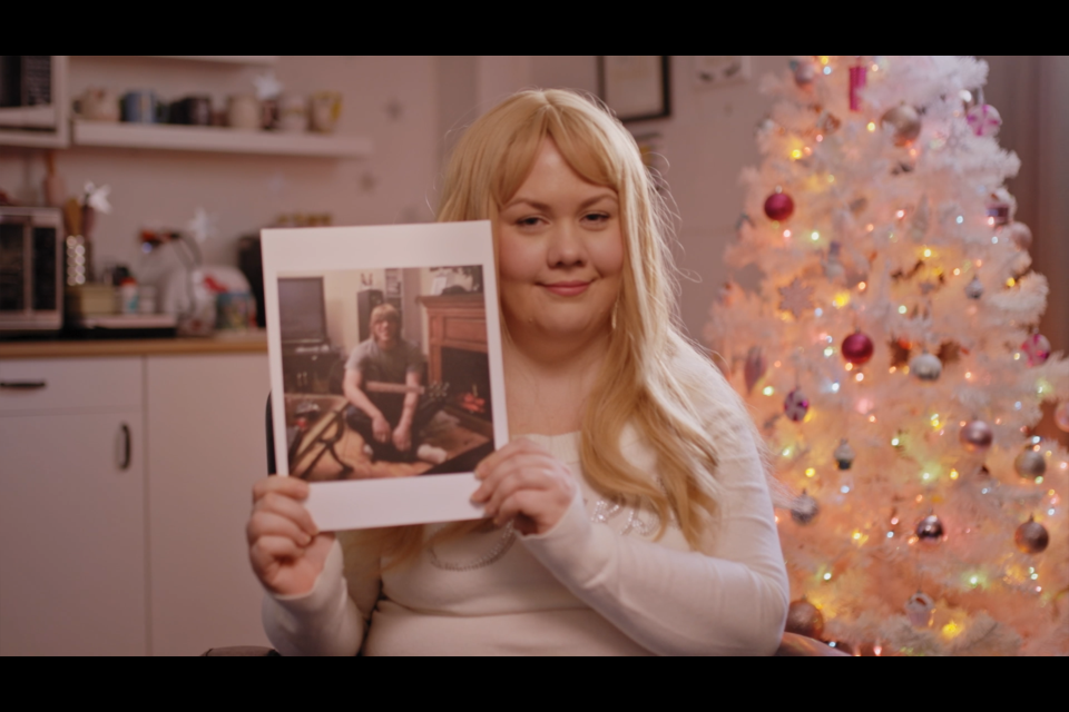 Twin Lakes Secondary School graduate Victoria Hammond shows a photo that features her classmate, Ben Taylor. The two recently reunited to deal with their past as part of a TVO documentary series called Yearbook.