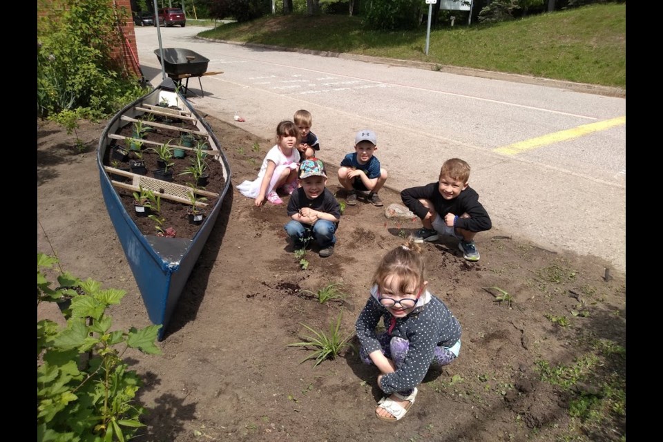 Students from K.P. Manson School in Severn Bridge plant a butterfly-friendly garden this week. Contributed photo