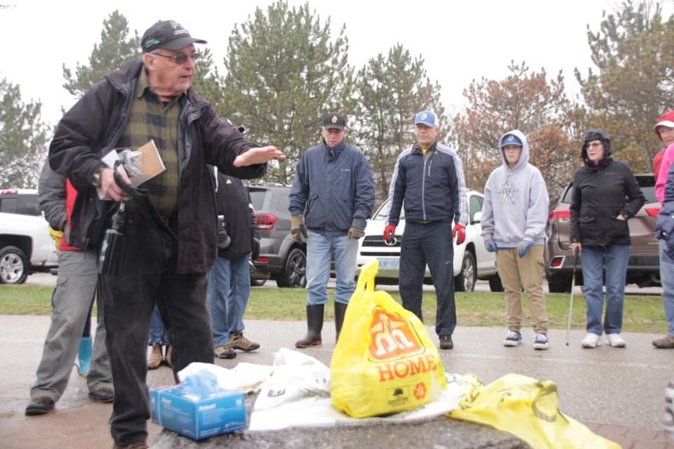 Bob Bowles, co-organizer of the annual clean up event, explained to participants how they were to sift through the trash they were picking up in their designated areas. Mehreen Shahid/OrilliaMatters