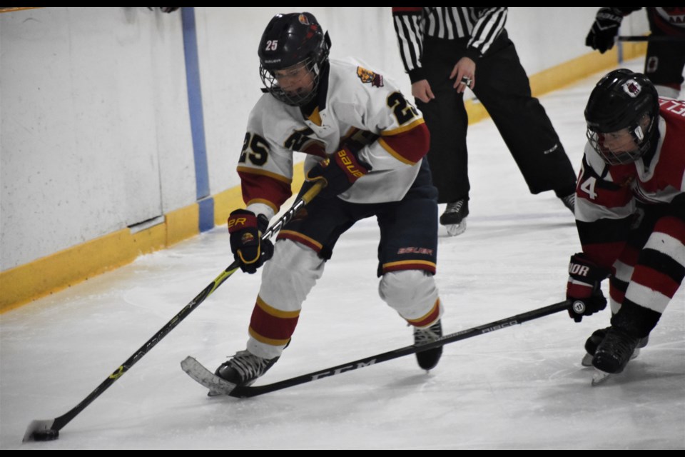 Connor McPherson takes the puck wide, streaking past the Ottawa blueliner to create a scoring chance in the bronze-medal match of the Ontario Winter Games AAA peewee championship at the Rama MASK. Dave Dawson/OrilliaMatters