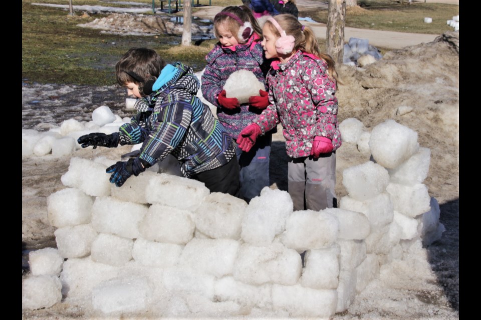 Cameron McKellar, 5, and his sisters, Autumn and Lily, 7, worked together to build their own ice castle. The Stouffville siblings used ice bricks leftover from the massive ice castle built last week that melted as a result of mild temperatures. Mehreen Shahid/OrilliaMatters