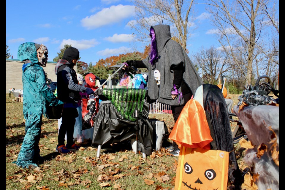 Sara Ranson hands out treats to kids. Nathan Taylor/OrilliaMatters