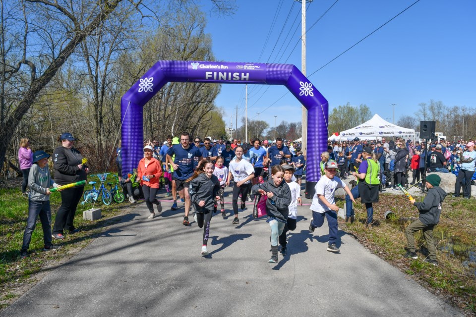 Participants pass the start line during Charlee’s Run on Saturday at Tudhope Park.
