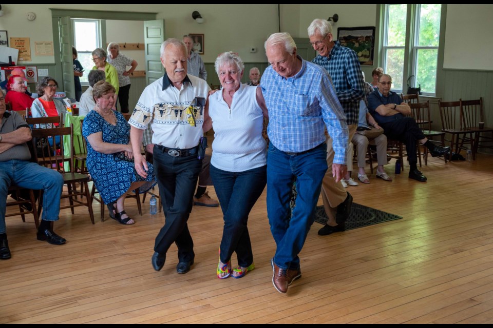 About 100 people packed into Eady Hall in Oro-Medonte on Saturday for the annual Fiddle Jam event that supports COPE Service Dogs.