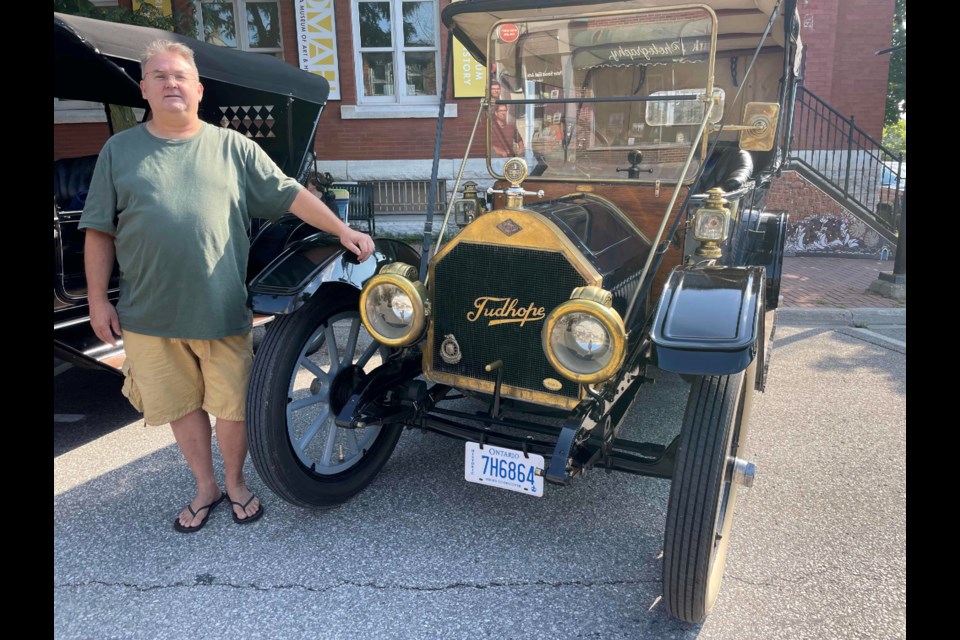 Peter Voisey is shown Saturday at the Downtown Orillia Classic Car Show with his 1912 Tudhope 436.