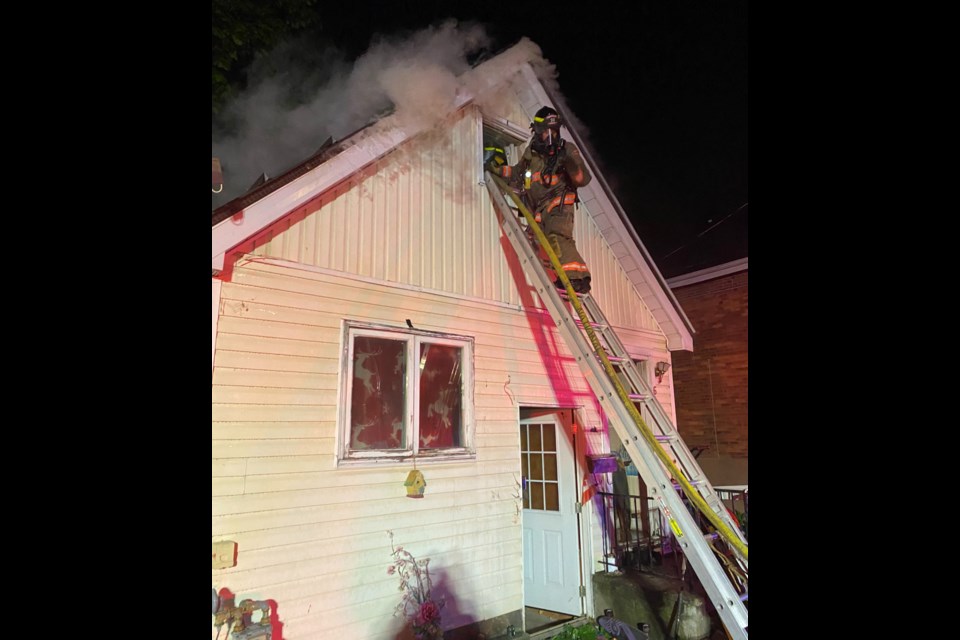 Four people fled a burning home on Matchedash Street early Saturday morning and firefighters rescued another male from the home who was unconscious, says Orillia Fire Chief Michael Clark.