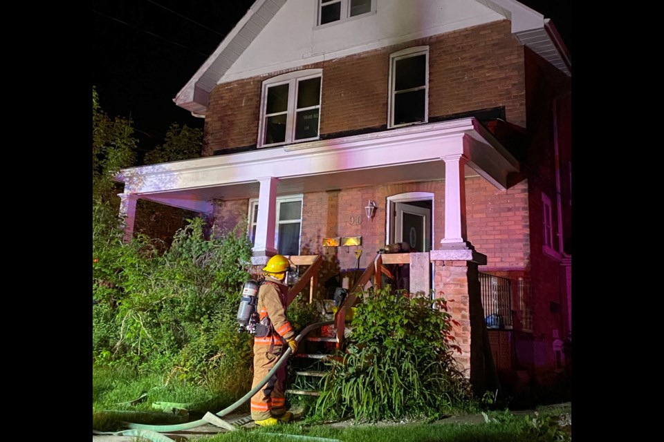 Firefighters battle a blaze at a triplex on Coldwater Road in the wee hours of Saturday morning.