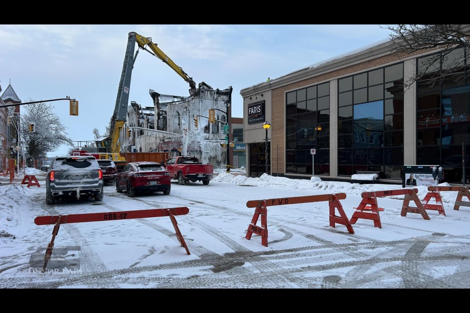 Crews from Priestly Demolition are continuing to demolish parts of the 130-year-old building at the corner of Peter and Mississaga streets. There are still some hot spots in the building ravaged by Tuesday's fire.