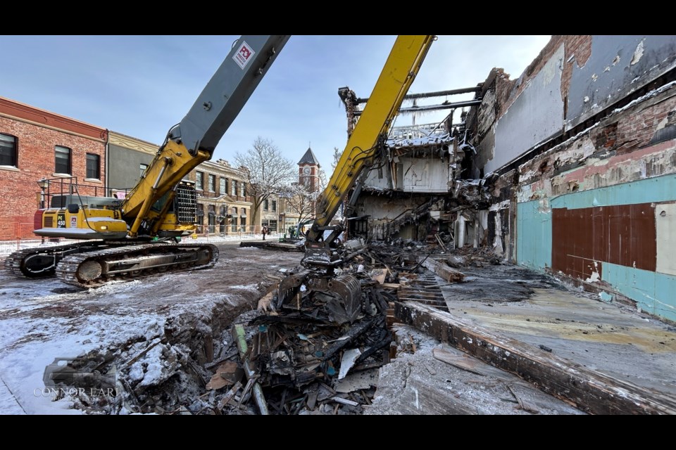 Crews continue to demolish the fire-ravaged building at the corner of Peter and Mississaga Streets that was destroyed by fire on Jan. 21.