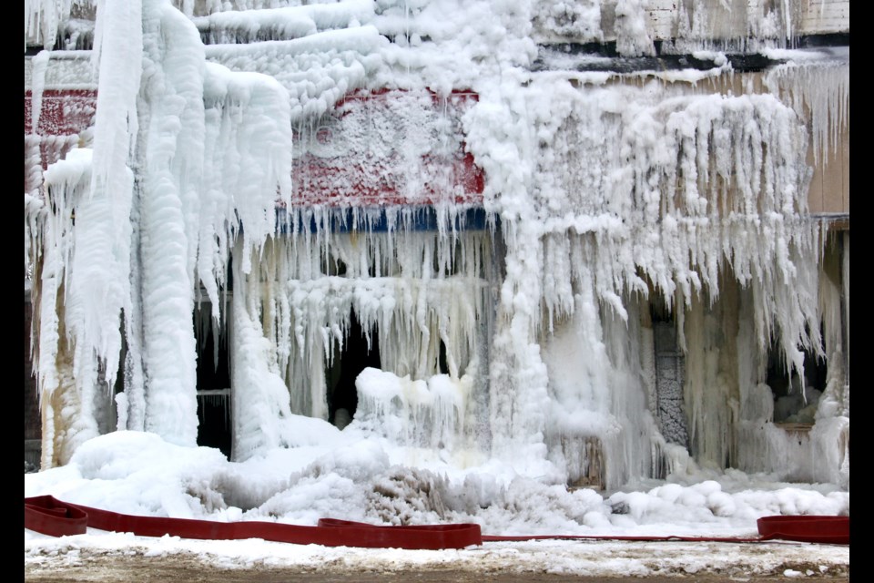 Ice covers the burned-out building that housed Dr. Comics and Kelly's Klothing on Mississaga Street and three businesses on Peter Street in downtown Orillia after the Jan. 21 fire. 