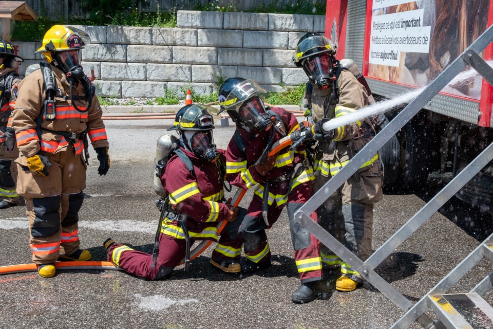 Participants of Camp Molly put out a trailer fire behind the Orillia Fire Department on Gill Street on Thursday afternoon.