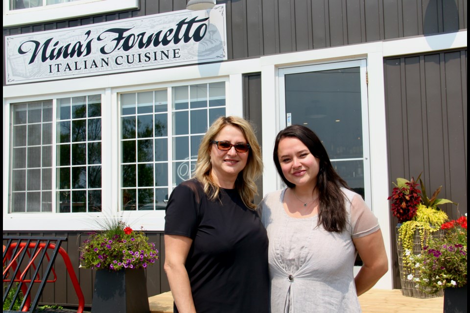 Nina's Fornetto Fine Italian Cuisine owner Nina Birjovanu and daughter Ioana Birjovanu, are seen outside the new 2804 Lakeshore Rd. E. location in Oro-Medonte Township.