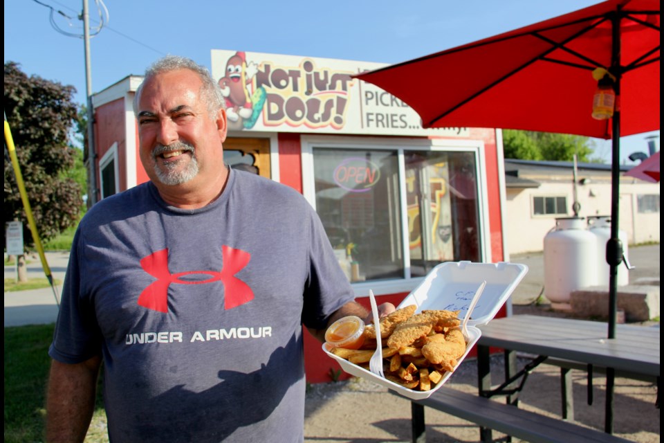 Not Just Dogs! owner Chris Stewart  has been in business at 595 West St. S. for eight years. He said people love to eat at his food truck, one of several in Orillia.