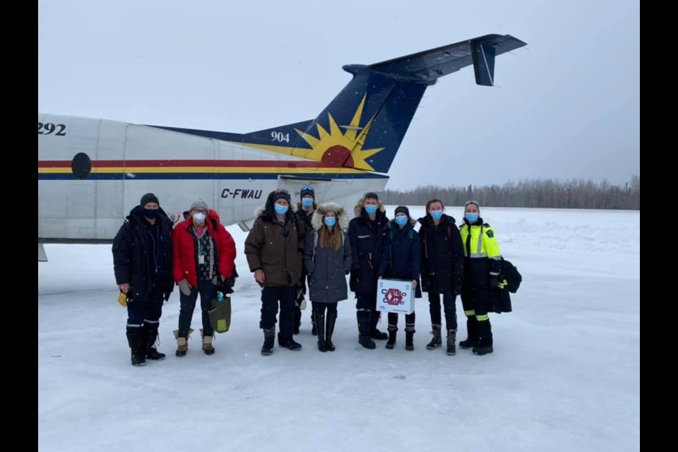 Jonathan Lee (fourth from the right), a Georgian College instructor and Ornge paramedic, and an Ornge vaccination team in Eabamatoong First Nation. Lee will return to the community on March 22 with a team of six from Georgian to administer COVID-19 vaccines. (Photo courtesy of Jonathan Lee)