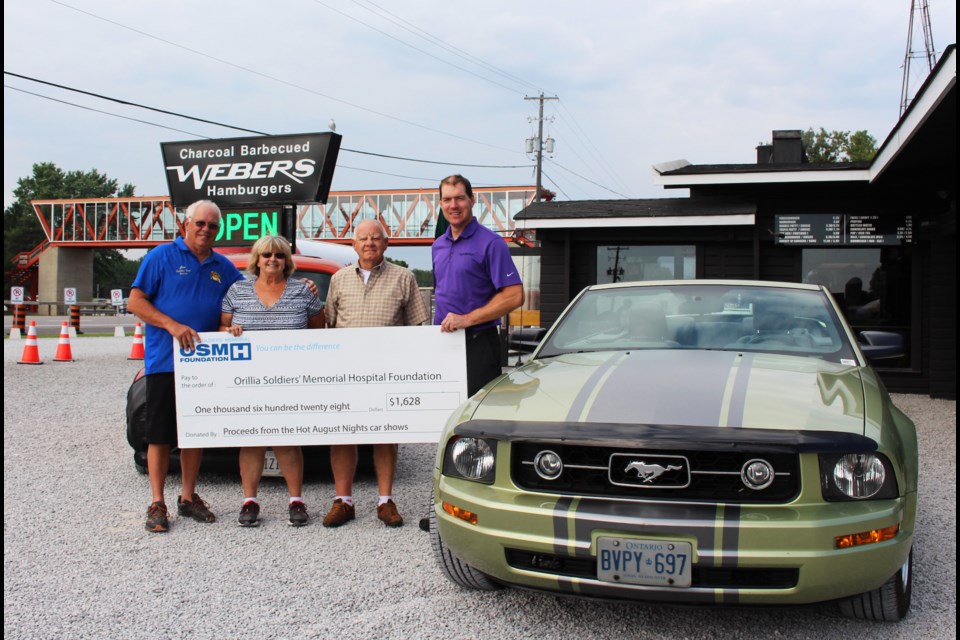 More than $1,600 has been presented to the Orillia Soldiers' Memorial Hospital Foundation on behalf of the “Hot August Nights” car show organizing committee. The funds were raised at four different car shows held Tuesday evenings at Webers in August. In total, more than a thousand cars participated in the shows, making it the largest cruise night in northern Ontario. As part of the total, a donation was also made by the Orillia Home Depot car show. Pictured are show organizers Jim and Pauline Pearsall, Barry Bird, and Brian Clarke, Manager, Webers. Submitted photo