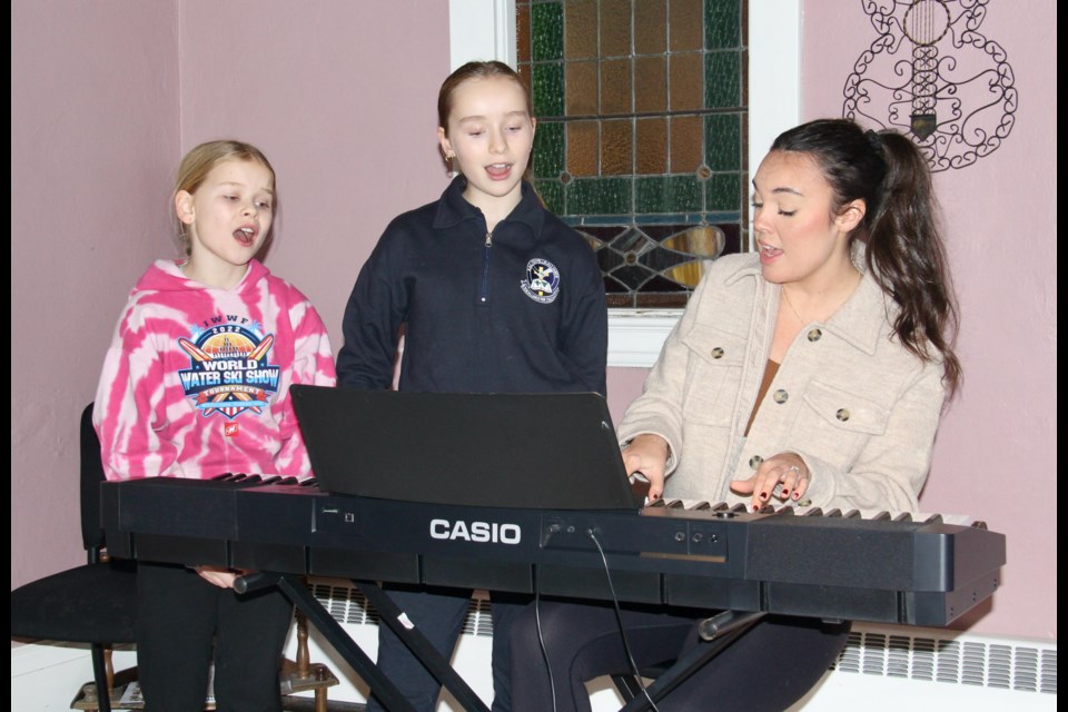 Country artist and music teacher Jaclyn Kenyon is seen with vocal students Maddie, left, and Gemma Cox, of Orillia.