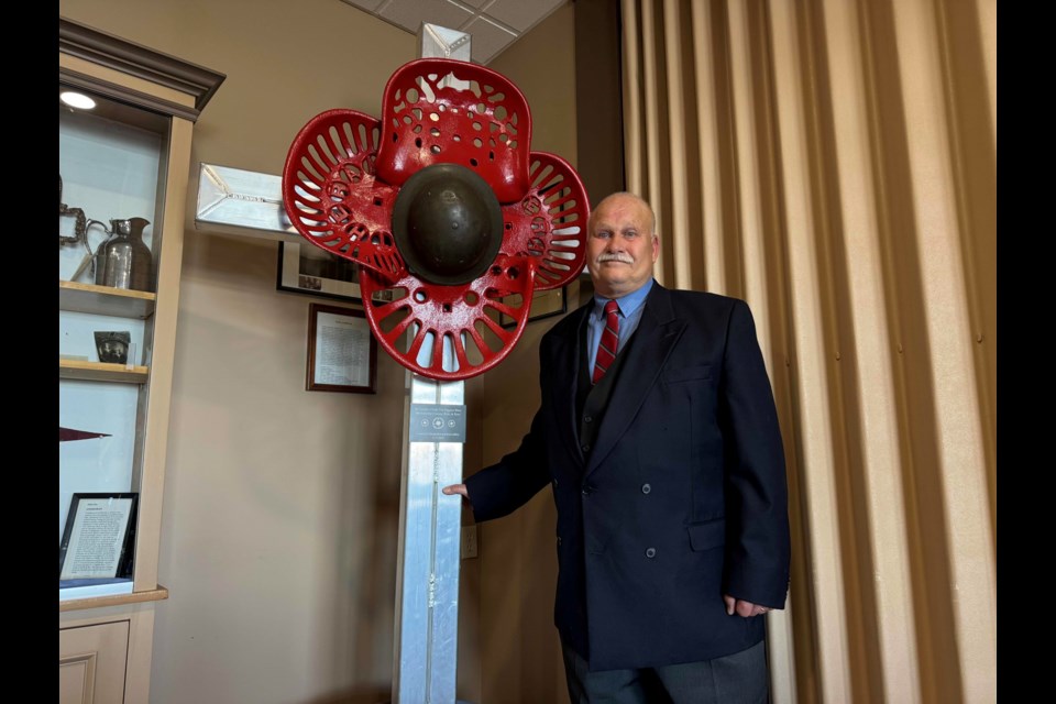 Local artist Donald Butt donated an eight-foot-tall poppy sculpture to the Royal Canadian Legion in Orillia on Tuesday.