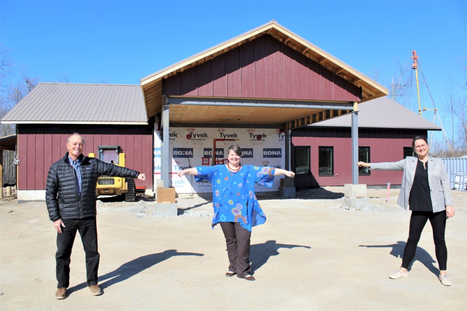 Mariposa House Hospice board co-chairs Si Lowry, left, and Erika Catford, right, give a social distancing fist bump to new executive director Annalise Stenekes on Wednesday outside the Brodie Drive facility. Nathan Taylor/OrilliaMatters