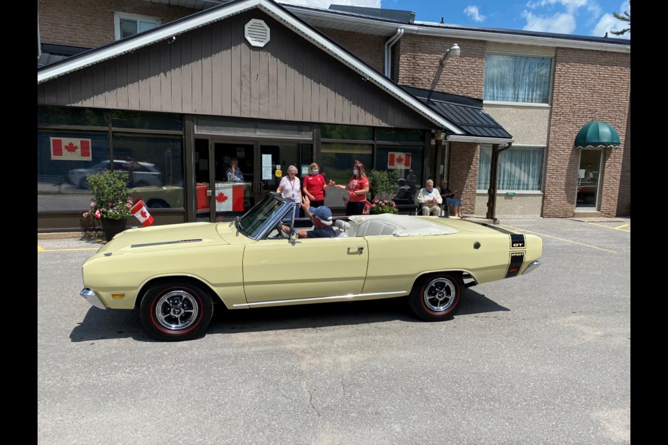 More than 20 people drove their cars to retirement and long-term care homes, including Birchmere Retirement Residence, shown here, in Orillia on Thursday to mark Canada Day.