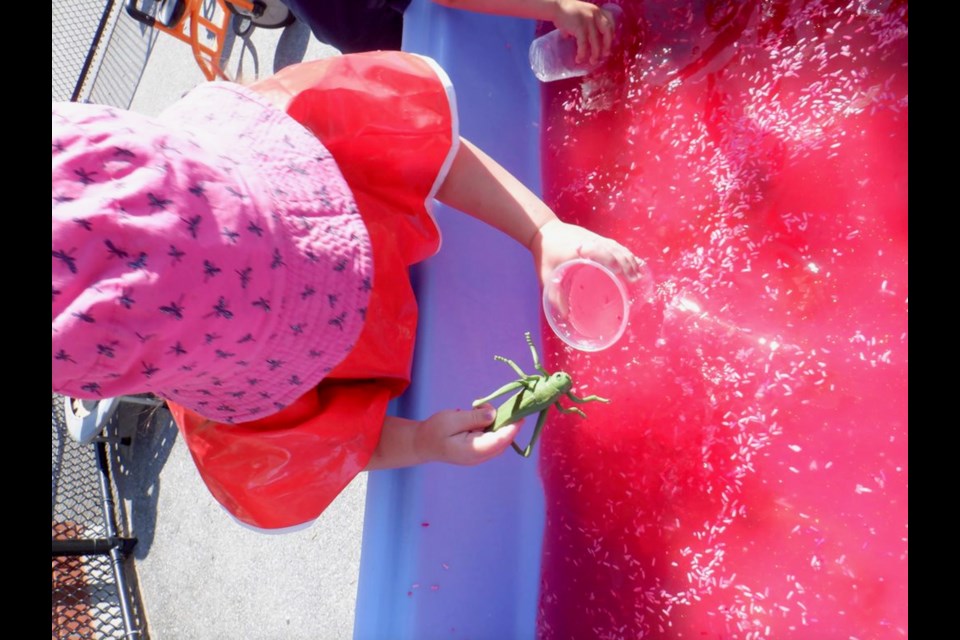 Violet MacMillan, 4, enjoys a sensory play experience at Orillia Central Preschool.