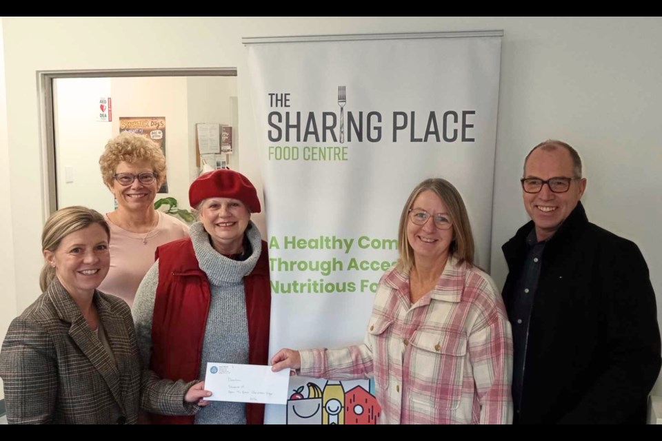 From left are Kelly Allen, development manager with The Sharing Place Food Centre, Sandy Patrick and Open to Grace Christian Yoga students Laurie Herd, Crystal Rosewell and Peter Rosewell.