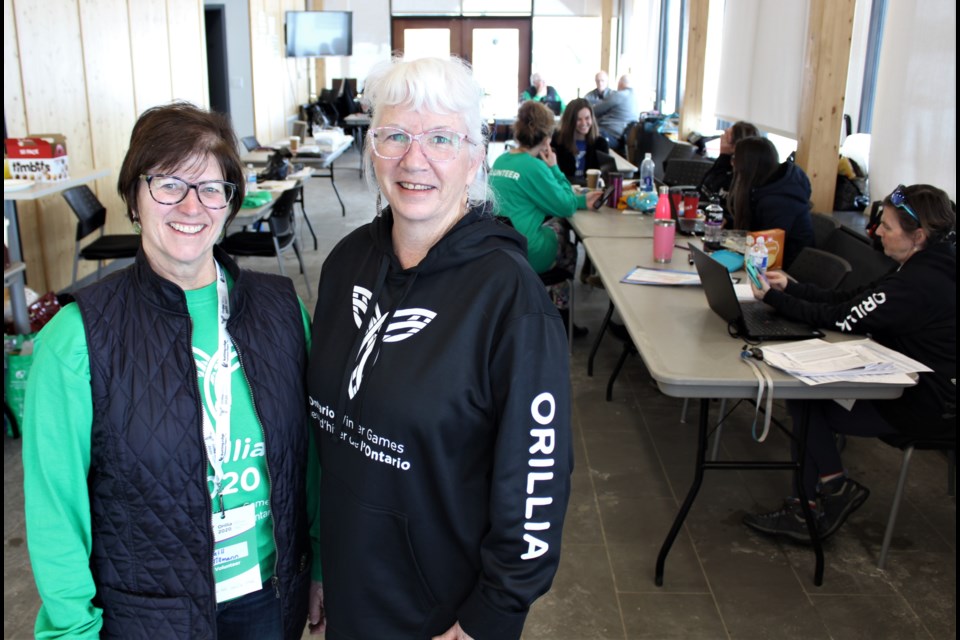 Gill Tillmann, left, and Mary O'Farrell-Bowers, co-chairs of the volunteer committee, are shown at the Orillia Waterfront Centre, which is serving as headquarters for the games organizing committee. Nathan Taylor/OrilliaMatters