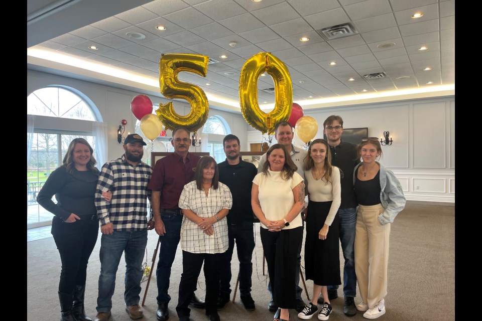 Eric Schop and proud family members celebrated his 50 years as a dedicated employee with Sanderson Monument on Thursday.