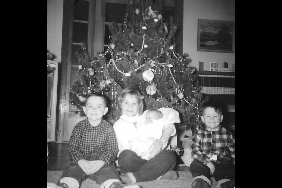 The Stanton siblings in 1964. Dianne, only one year old, was held by sister Sandra here (age 7); Doug (at left) was four. Bruce, at left, is just days after his seventh birthday.