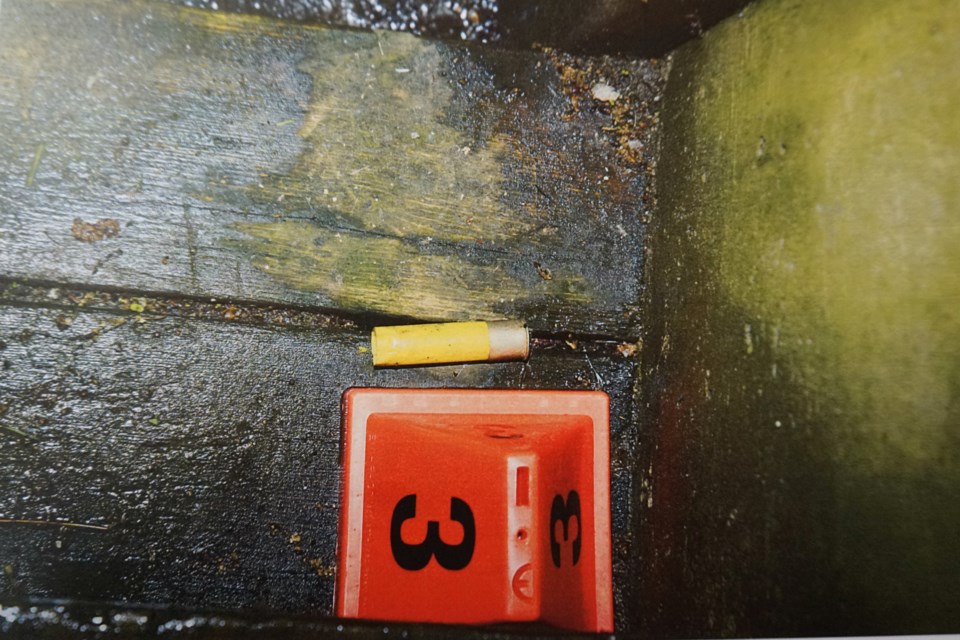 Police evidence photo of a shotgun shell casing found at 282 Franklin St., presented during the first-degree murder trials of Martin Forget and Brian Quesnel. 