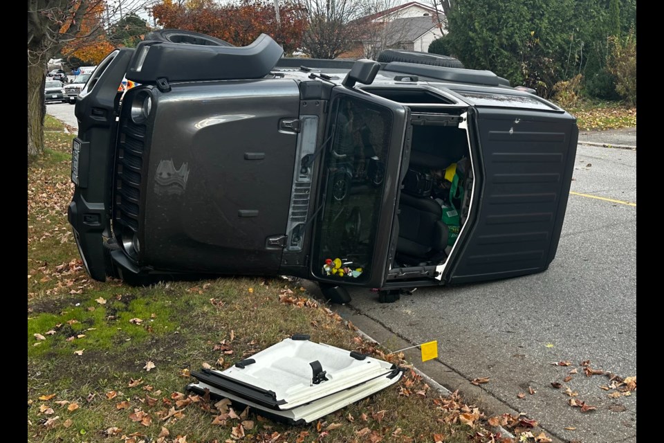 A Jeep landed on its side after a two-vehicle crash on Rose Avenue Tuesday afternoon. 