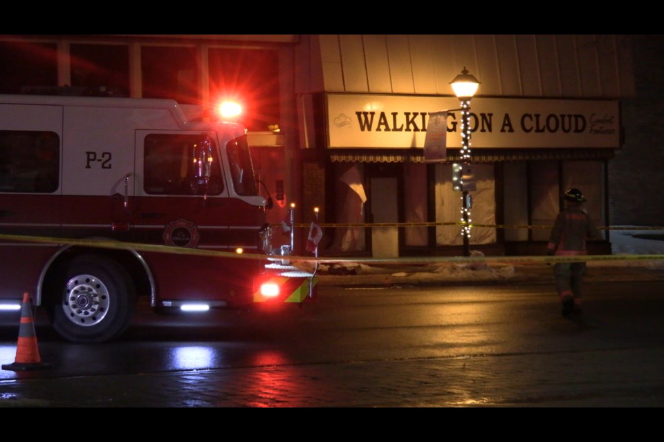 The roof at the back of the building that houses Walking on A Cloud has collapsed, according to witnesses. The long-time downtown shoe store has been closed for some time. No injuries have been reported.