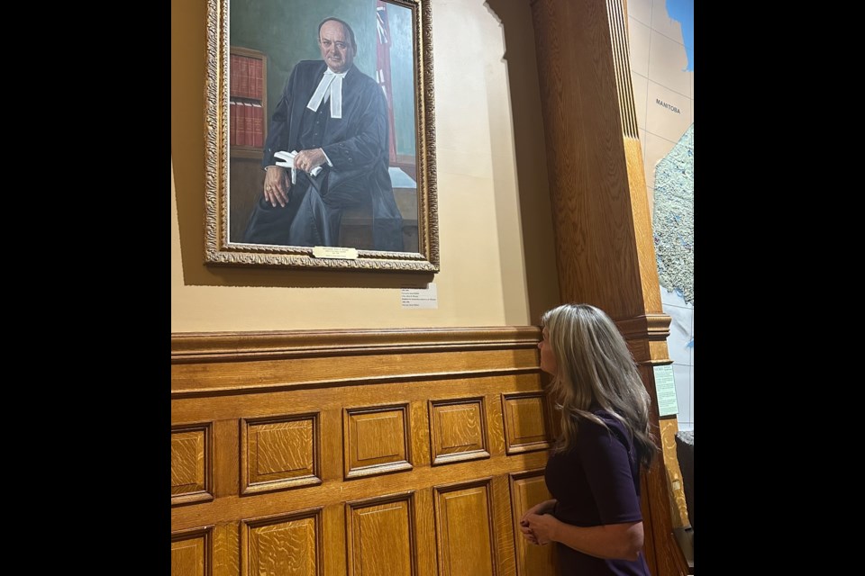 Current Simcoe North MPP Jill Dunlop looks upon a portrait of former local MPP and Speaker Al McLean at Queen's Park. McLean died earlier this month.