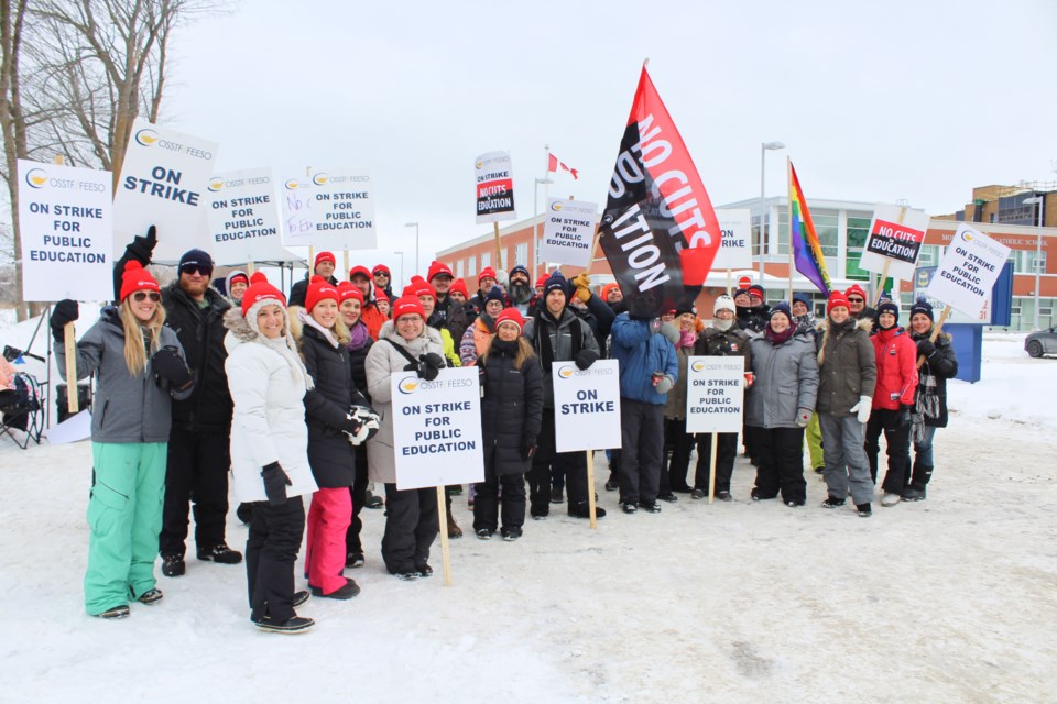 Teachers and other staff members were back on the picket line Tuesday in front of Monsignor Lee Catholic School. Nathan Taylor/OrilliaMatters