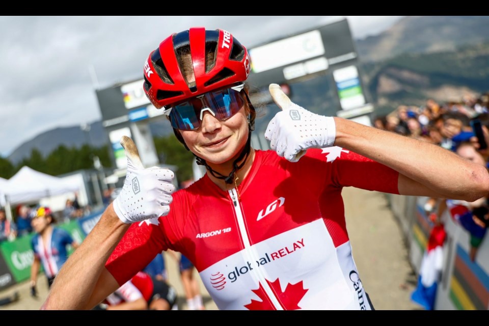 Isabella Holmgren gives a double thumbs up after winning a pair of world championship titles at the recent Mountain Bike World Championships in Andorra.