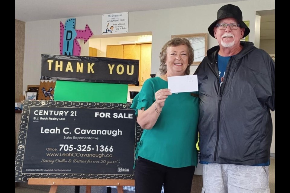 Brian Minns placed first during the Orillia Lawn Bowling Club’s recent Fun Day competition. He is shown with sponsor Leah Cavanaugh.