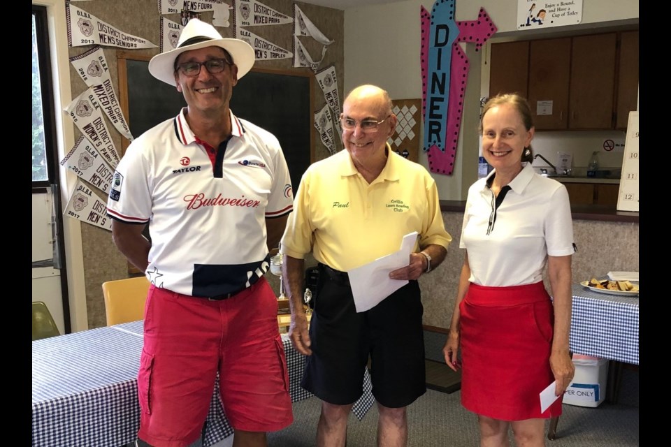 Orillia’s Robb Barsevich and Laurie McLeod won three games at Thursday's Australian Pairs Tournament at the Orillia Lawn Bowling Club. They are shown with drawmaster Paul Evans.