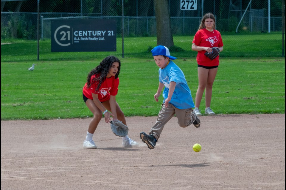 Challenger Baseball players took on their coaches in a spirited battle during Baseball Day in Orillia at Kitchener Park on Saturday.