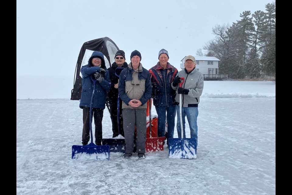 A group of local seniors have poured their heart and soul into building a 15,000-square-foot rink on Lake Couchiching for the community. From left are local seniors Ken Braun, David Cross, Ted Foxley, John Degraaf, and Derek Mackesy who, along with Greg Paquin, construct the rink on Brewery Bay each year. 