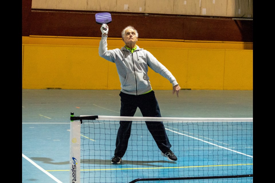 Glen Morehouse bats down a high shot during ODAS Park Pickleball Club action. 