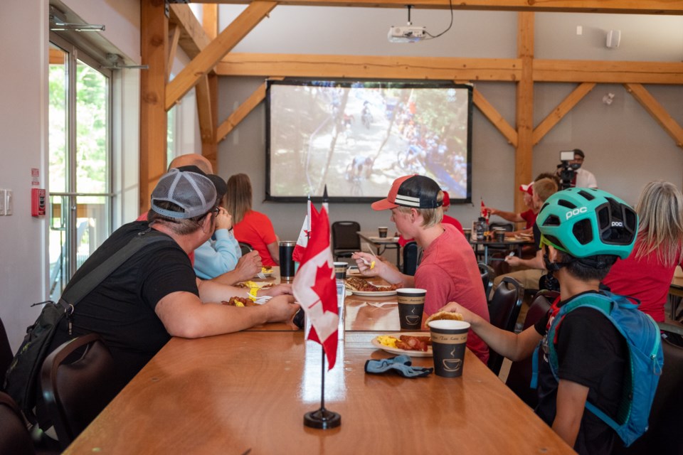 Local cyclists at Hardwood Ski and Bike took a break this morning to cheer on Gunnar Holmgren who was competing in the the men's Olympic cross-country event in Paris. 