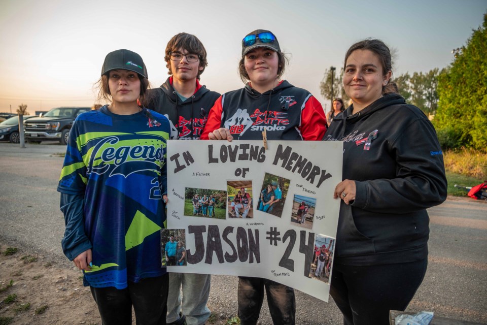 Jason Sawyer was killed in a crash in downtown Orillia on Saturday afternoon. He was honoured by his slo-pitch family and his children at Kitchener Park on Tuesday evening. His kids are, from left, Hannah, Jason Jr., Madison and Emaleigh.