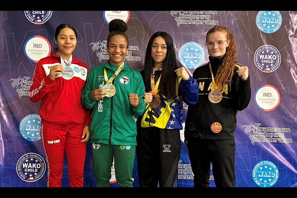 McKenna Van Allen, right, won the bronze medal at the Pan American Kickboxing Championships in Chile  this month. 