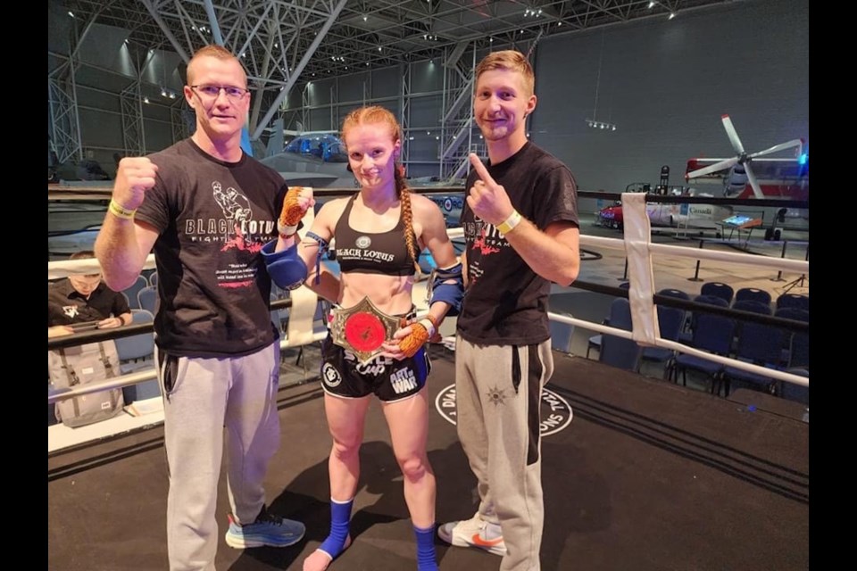McKenna Van Allen won the Ontario 54 kg female Muay Thai Championship earlier this month. From left are Black Lotus Academy of Martial Arts and Fitness coach Nic Langman, Van Allen, and coach Kai Clement.  