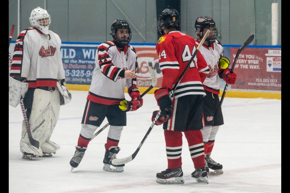 Terriers defenceman Lucas Wessinger and Cougars forward Nathan DeGazio share a moment of respect following a series that saw plenty of rough moments. Schomberg dominated Orillia 5-1 in the Game 7 showdown at Rotary Place to win the best-of-seven series 4-3.