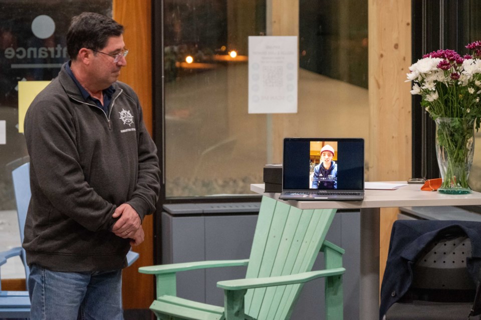 Marc Ackert watches as his son Ian accepts the 2024 Orillia Athlete of the Year award virtually from Barcelona Spain. 