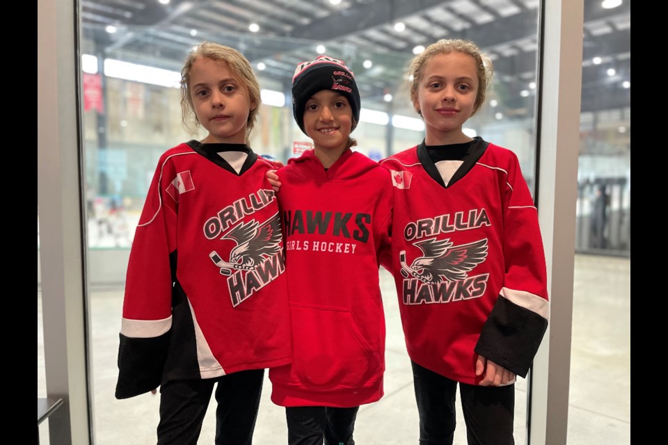 Members of the U11 Orillia Hawks spent the day building friendships during the Orillia Girls Hockey Association House League Tournament on Friday. From left are Zoey Mcleod, Ali Almeida and Paige Mcleod.