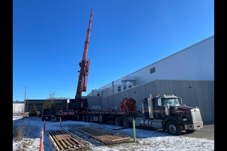 A massive crane was seen lifting dry coolers onto the rooftop of Rotary Place in west Orillia Wednesday.