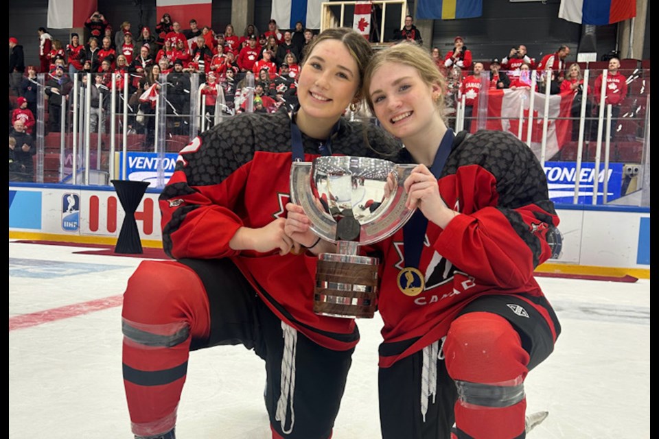 Rama teen Sydney Sawyer, left, is pictured with teammate Rachel Piggot while celebrating victory at the U18 World Women’s Hockey Championships.  